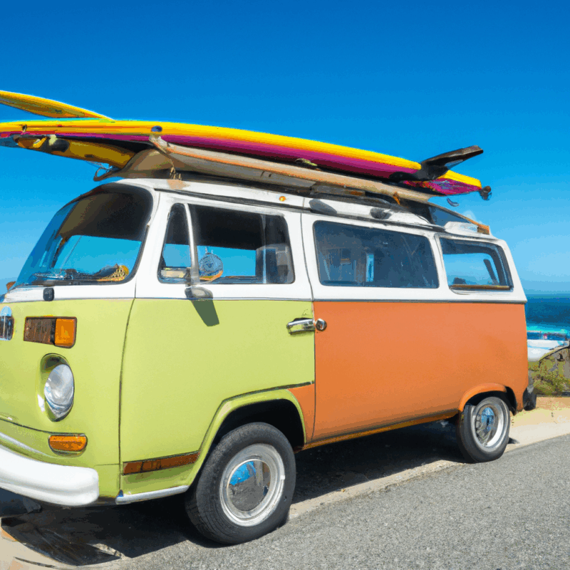 classic Volkswagen Type 2 (T1) Microbus in vibrant two-tone colors, parked on a scenic coastal road, with surfboards on the roof rack, under a clear blue sky